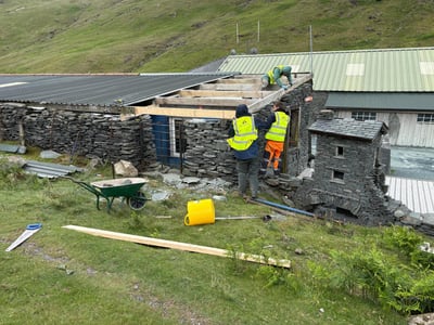 Stone wall damage repair - insurance restoration work